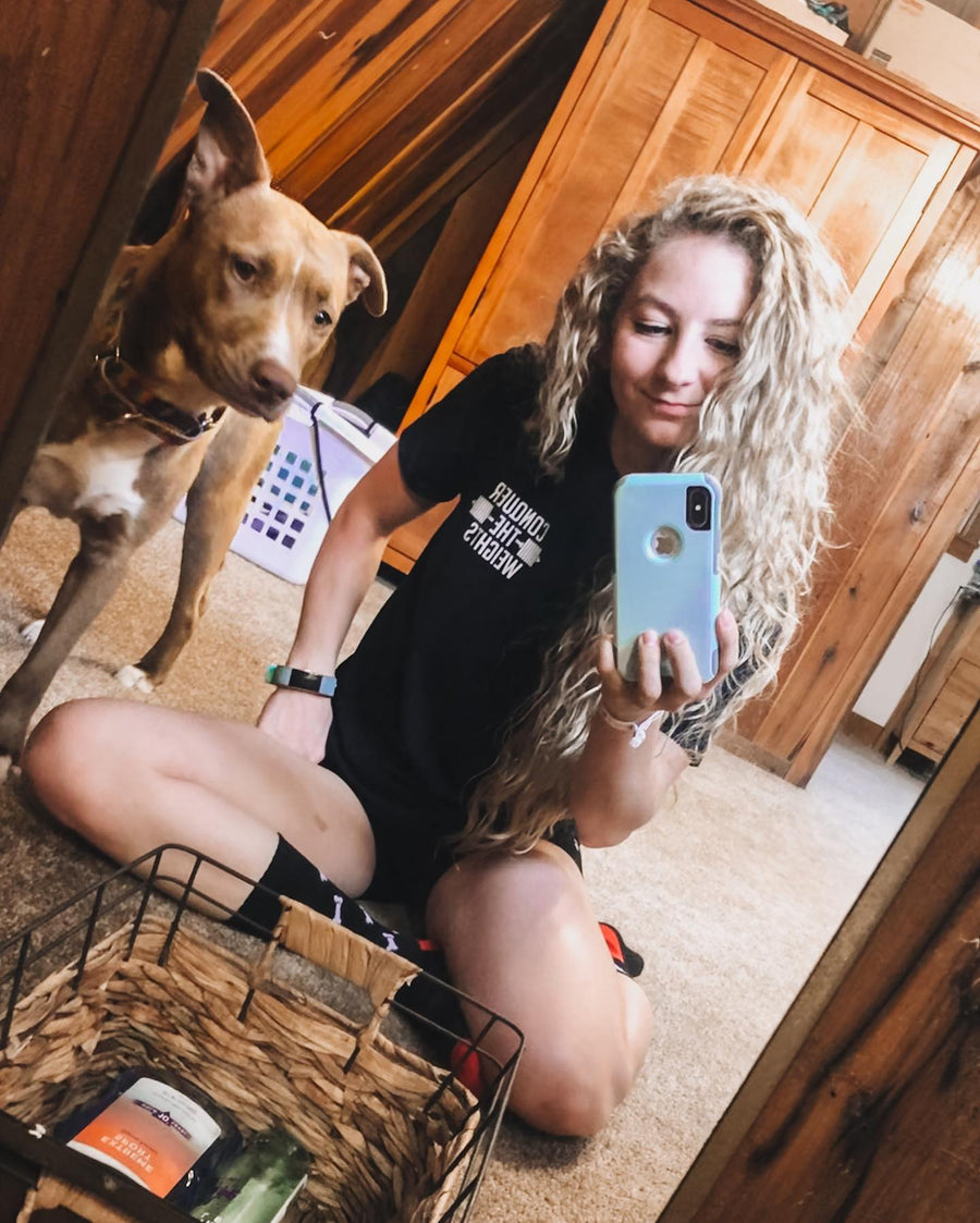 @michealemorgan mirror selfie in a Conquering Barbell tee with her dog