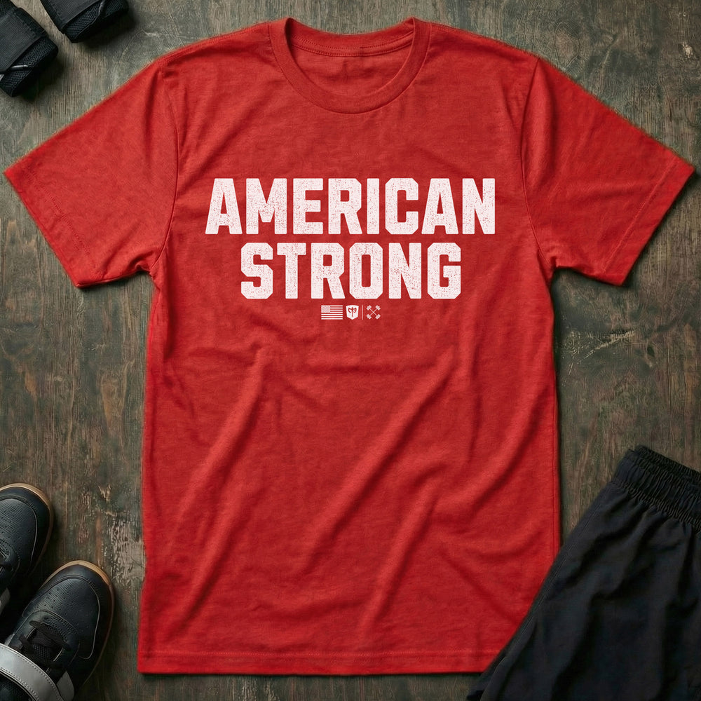 American Strong tee in Red: AMERICAN STRONG in bold distressed block letters with a small American flag