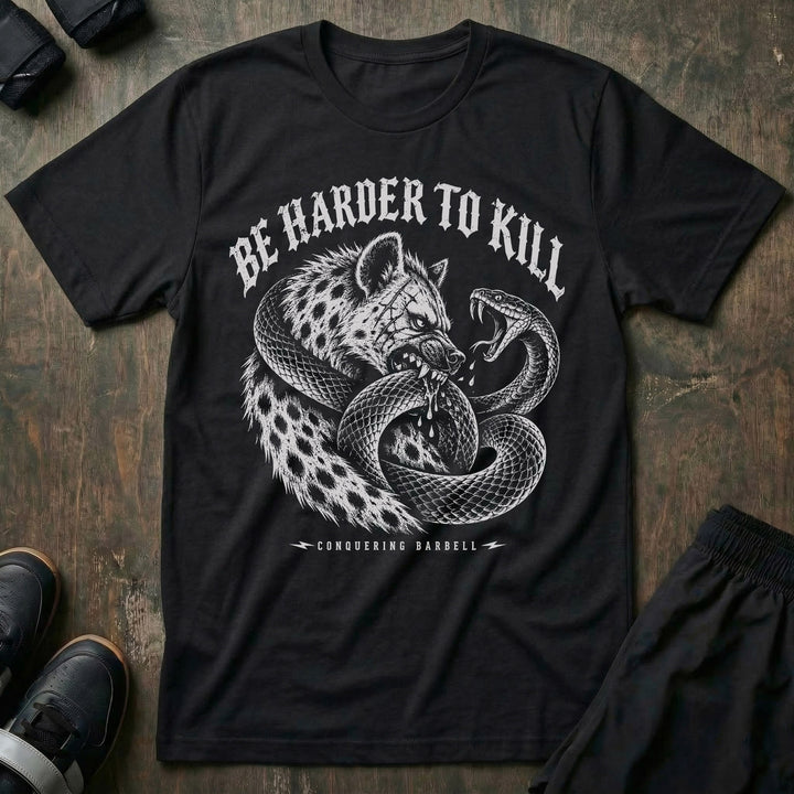 Be Harder to Kill Strike First tee in Black: a scarred hyena and a black mamba coiled around each other in full combat