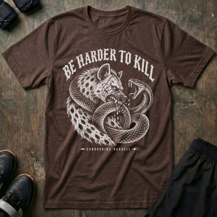 Be Harder to Kill Strike First tee in Expresso: a scarred hyena and a black mamba coiled around each other in full combat