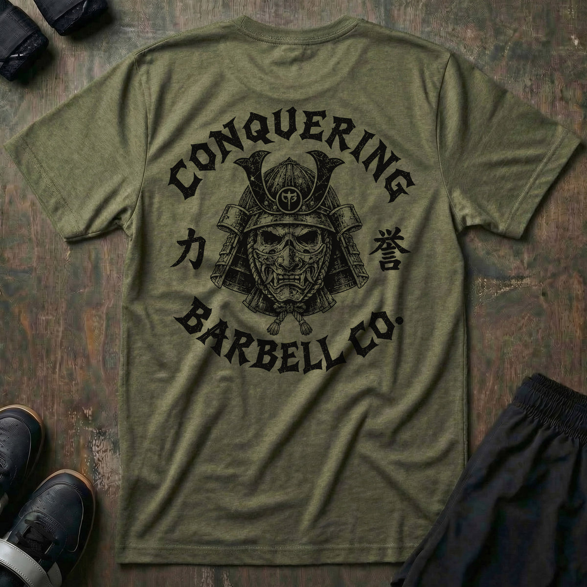 Bushido tee in Military: a skull-faced samurai in a full kabuto helmet and hannya war mask with the CB shield at the crown