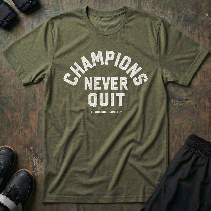 Champions Never Quit tee in Military: CHAMPIONS arched over NEVER QUIT in distressed varsity lettering
