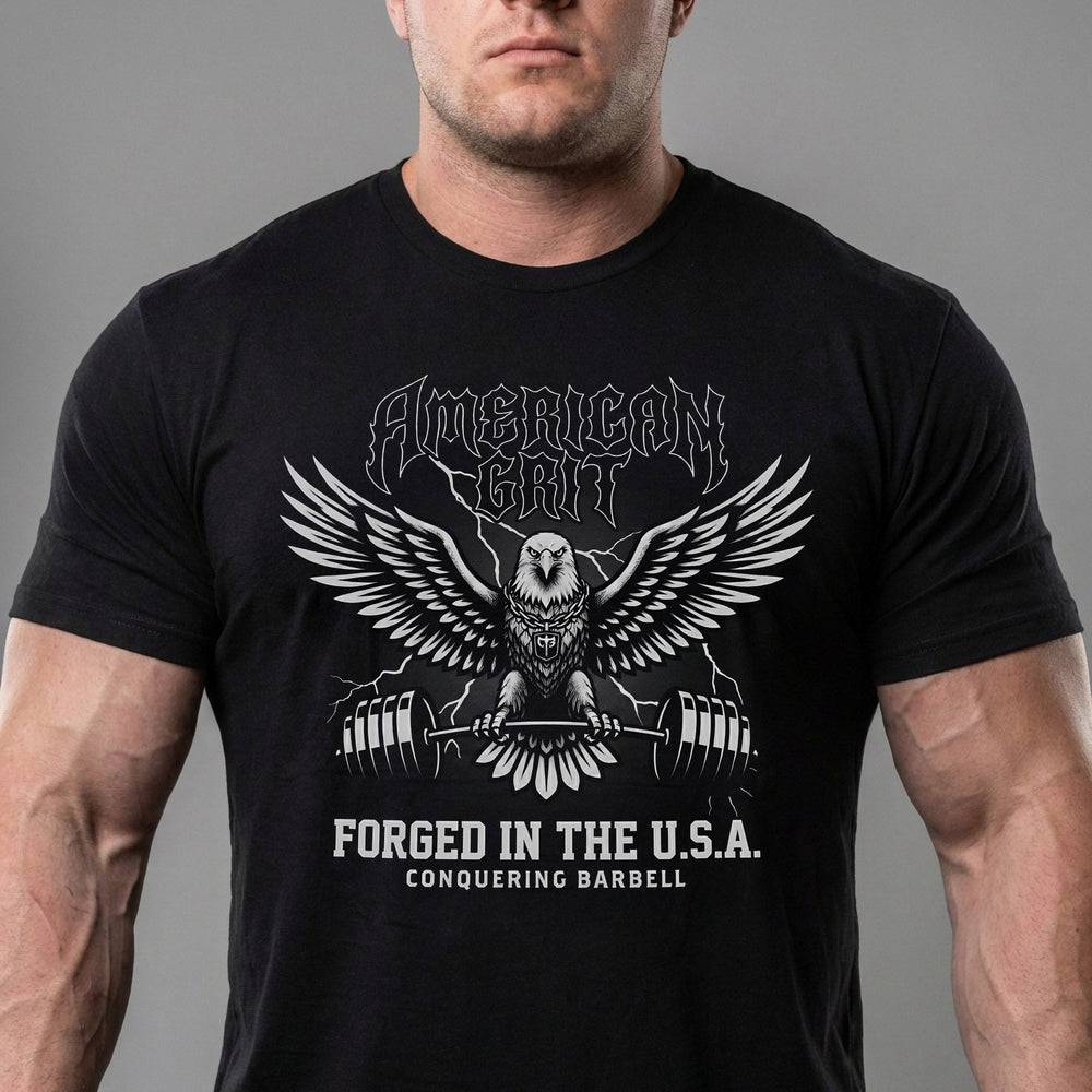 American Grit tee in Black: a metal-style eagle with wings spread clutching a barbell