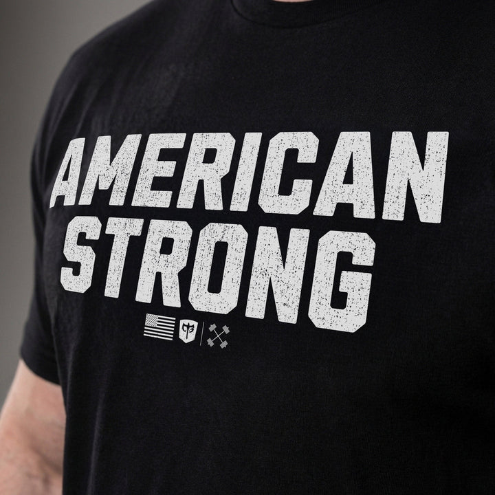 American Strong tee: AMERICAN STRONG in bold distressed block letters with a small American flag