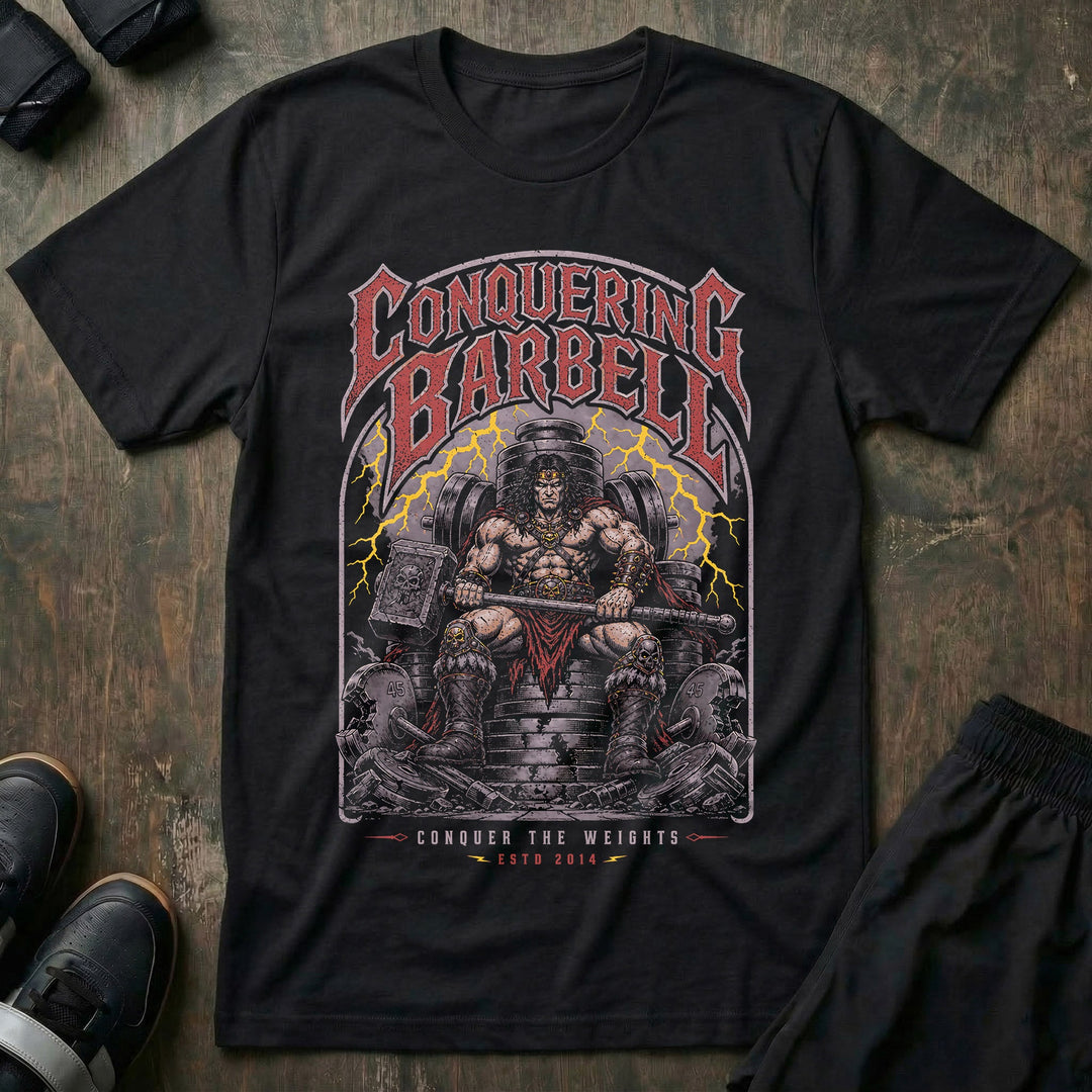 Barbell King tee in Black: a battle-worn warrior king seated on a throne made of stacked weight plates