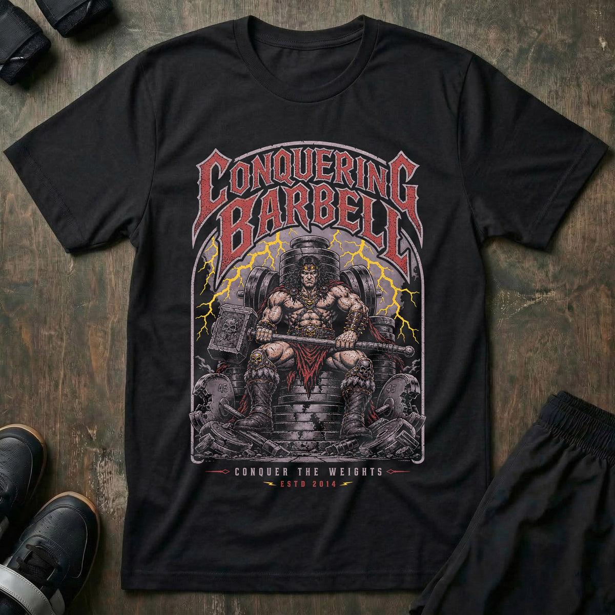Barbell King tee in Black: a battle-worn warrior king seated on a throne made of stacked weight plates