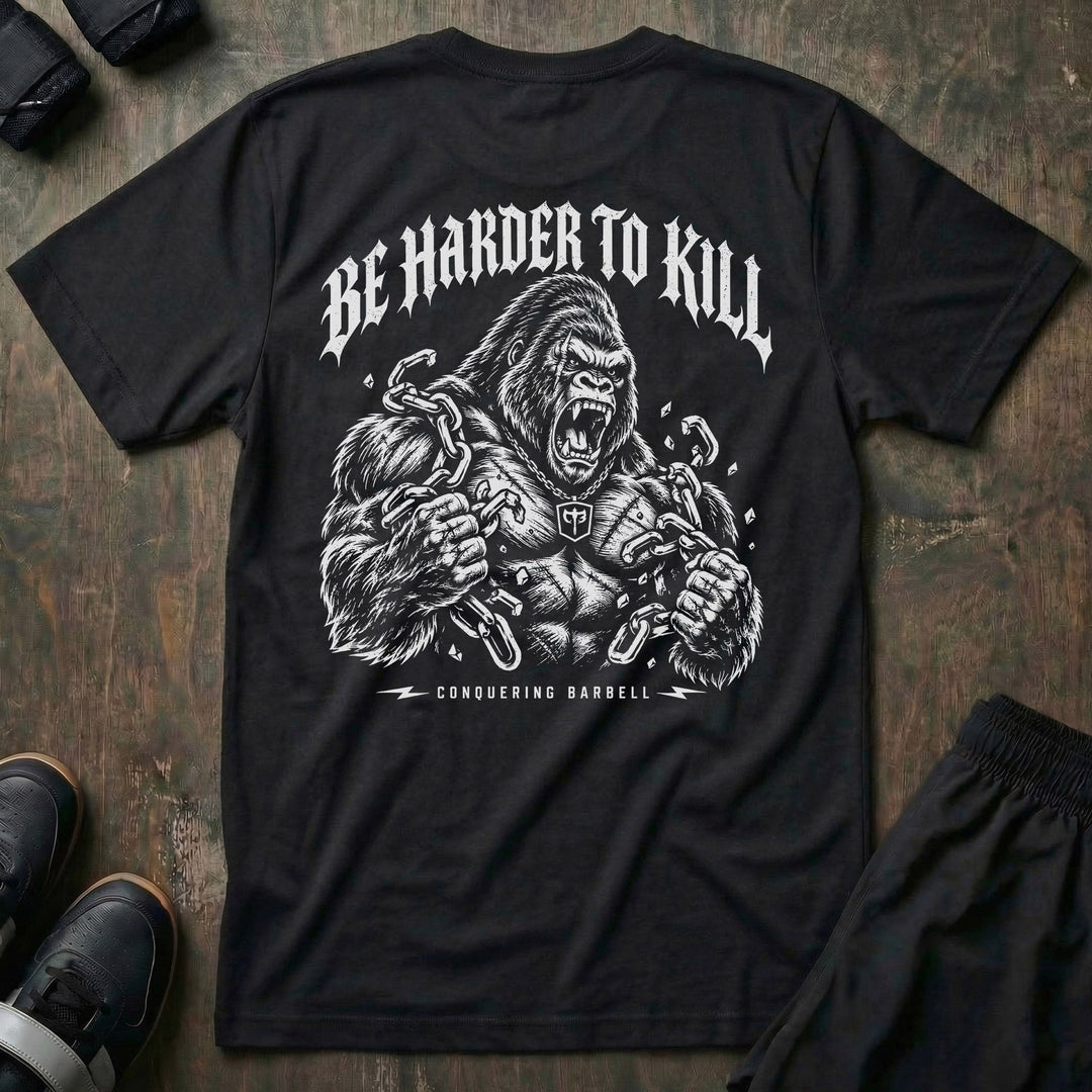 Be Harder to Kill Gorilla tee in Black: a massive silverback gorilla tearing heavy chains apart with both fists