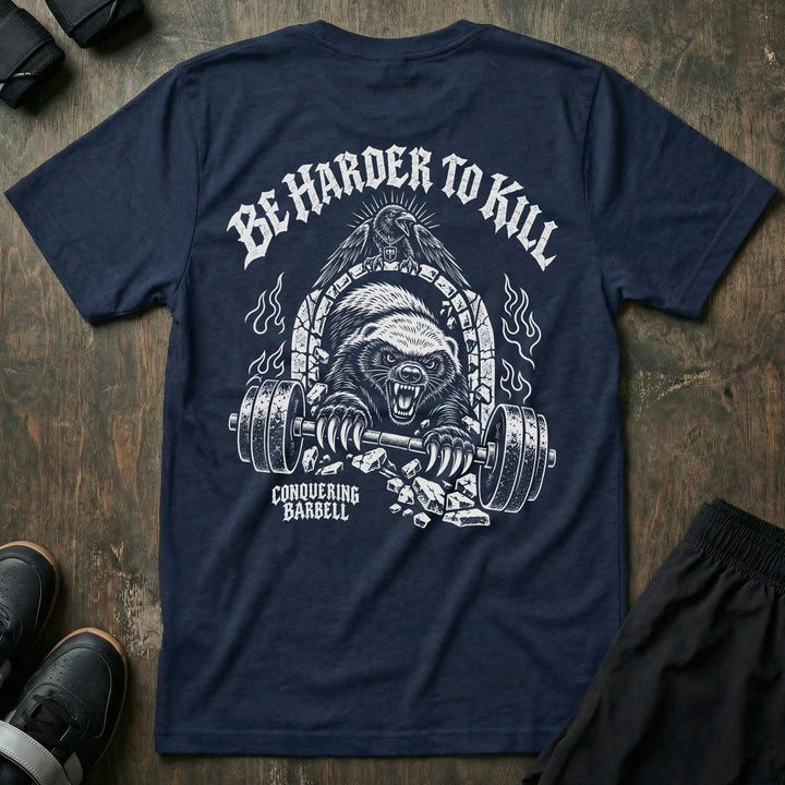 Be Harder to Kill Honey Badger tee in Navy: a snarling honey badger bursting through a stone arch with a loaded barbell