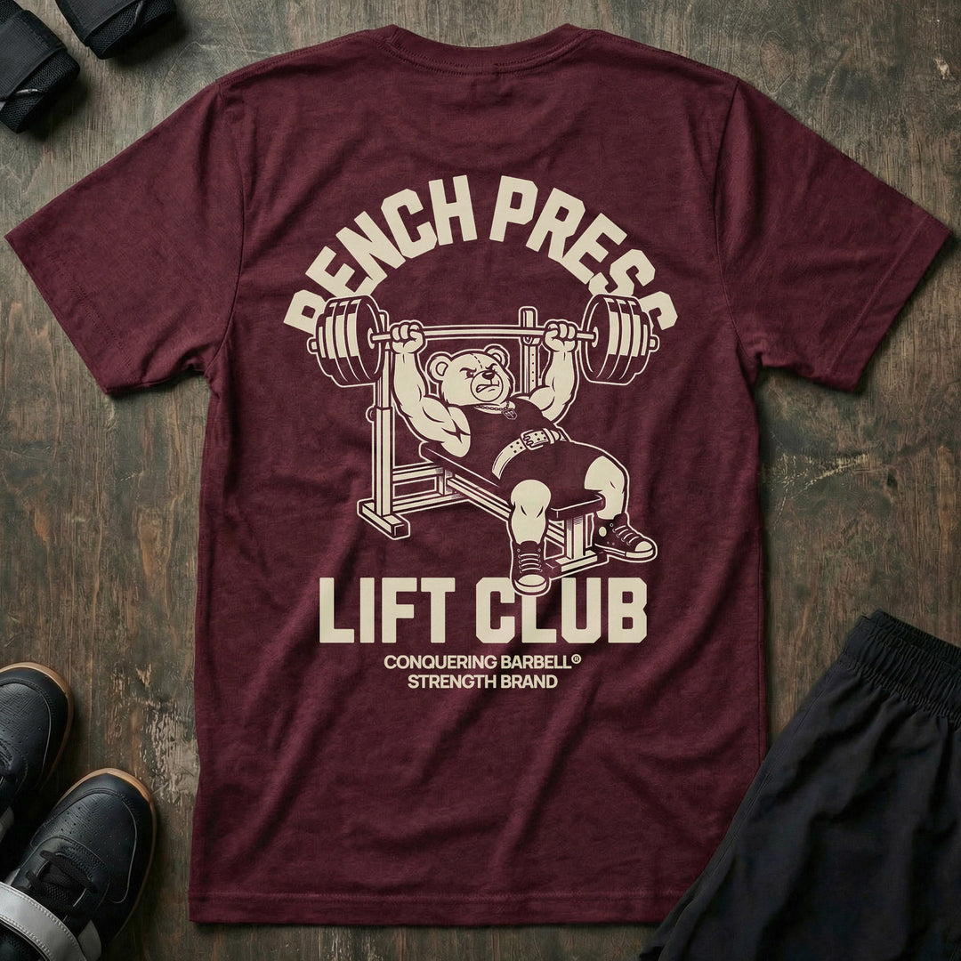 Bench Press Lift Club tee in Maroon: a classic teddy bear pressing heavy on the bench