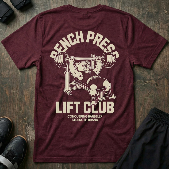 Bench Press Lift Club tee in Maroon: a classic teddy bear pressing heavy on the bench