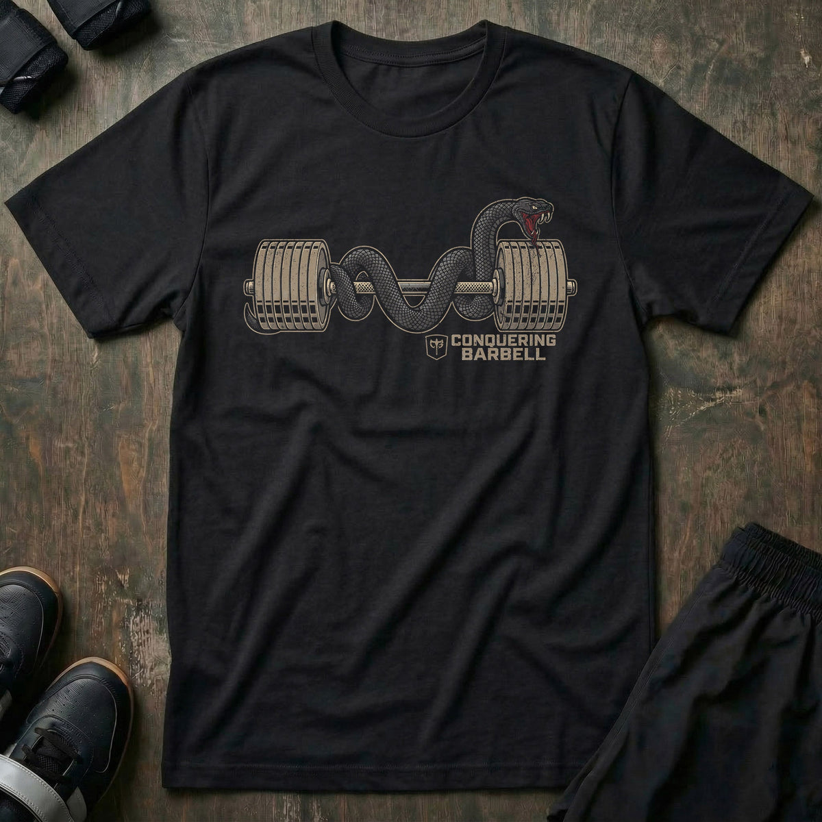 Barbell Mamba tee in Black: a black mamba coiled through the plates and along a fully loaded barbell