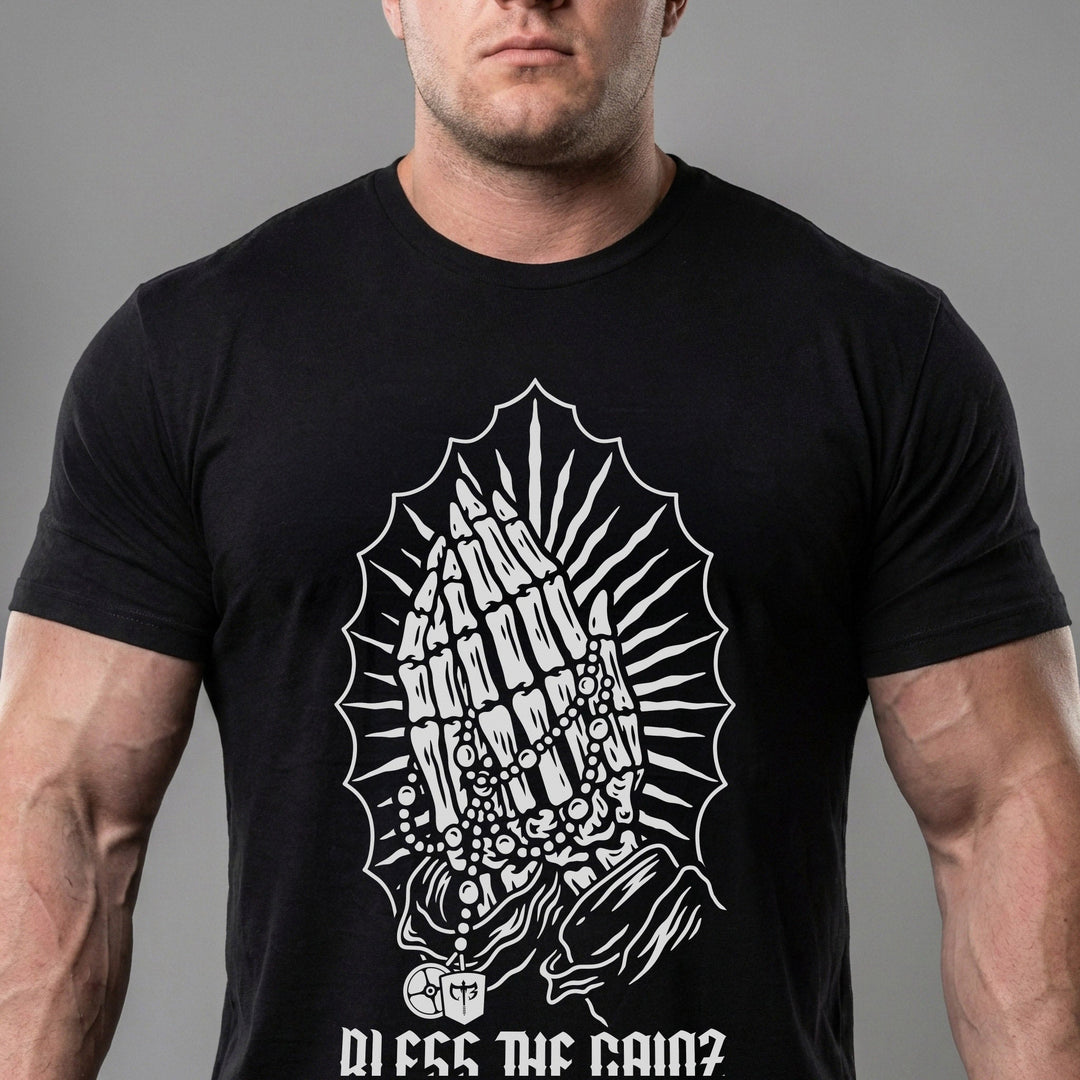 Bless the Gainz tee in Black: praying hands wrapped in a rosary inside a halo of radiating rays