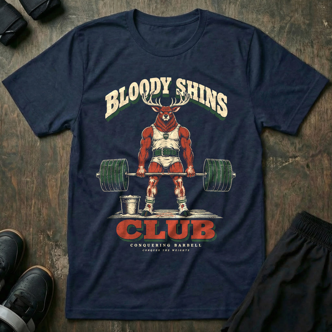 Bloody Shins Club - Tee front graphic in Navy with a stag at deadlift lockout with scraped red shins - Conquering Barbell