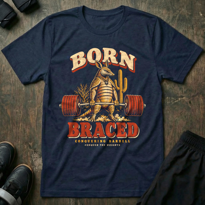 Born Braced - Tee front graphic in Navy with an armadillo deadlifting a loaded barbell in the desert - Conquering Barbell
