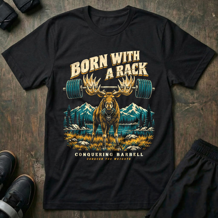 Born With a Rack - Tee front graphic in Black with a bull moose with a loaded barbell racked across its antlers - Conquering Barbell