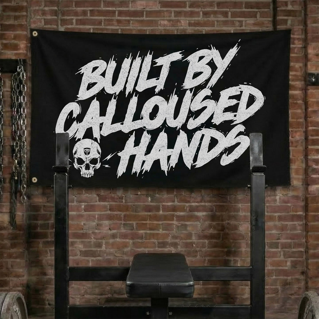 Built by Calloused Hands - Polyester Flag, horizontal black gym flag with BUILT BY CALLOUSED HANDS in white brush lettering - Conquering Barbell