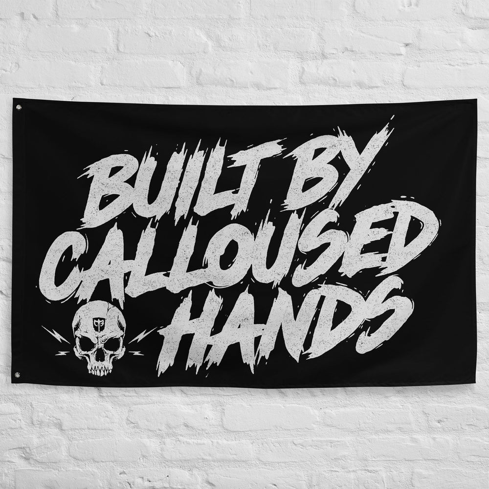 Built by Calloused Hands - Polyester Flag, horizontal gym flag hanging in a home gym - Conquering Barbell