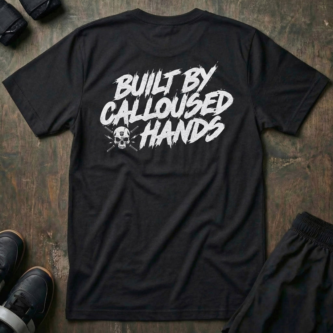 Built by Calloused Hands tee in Black: BUILT BY CALLOUSED HANDS in raw white brush lettering with a small skull