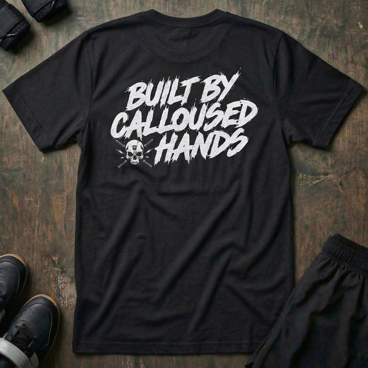 Built by Calloused Hands tee in Black: BUILT BY CALLOUSED HANDS in raw white brush lettering with a small skull