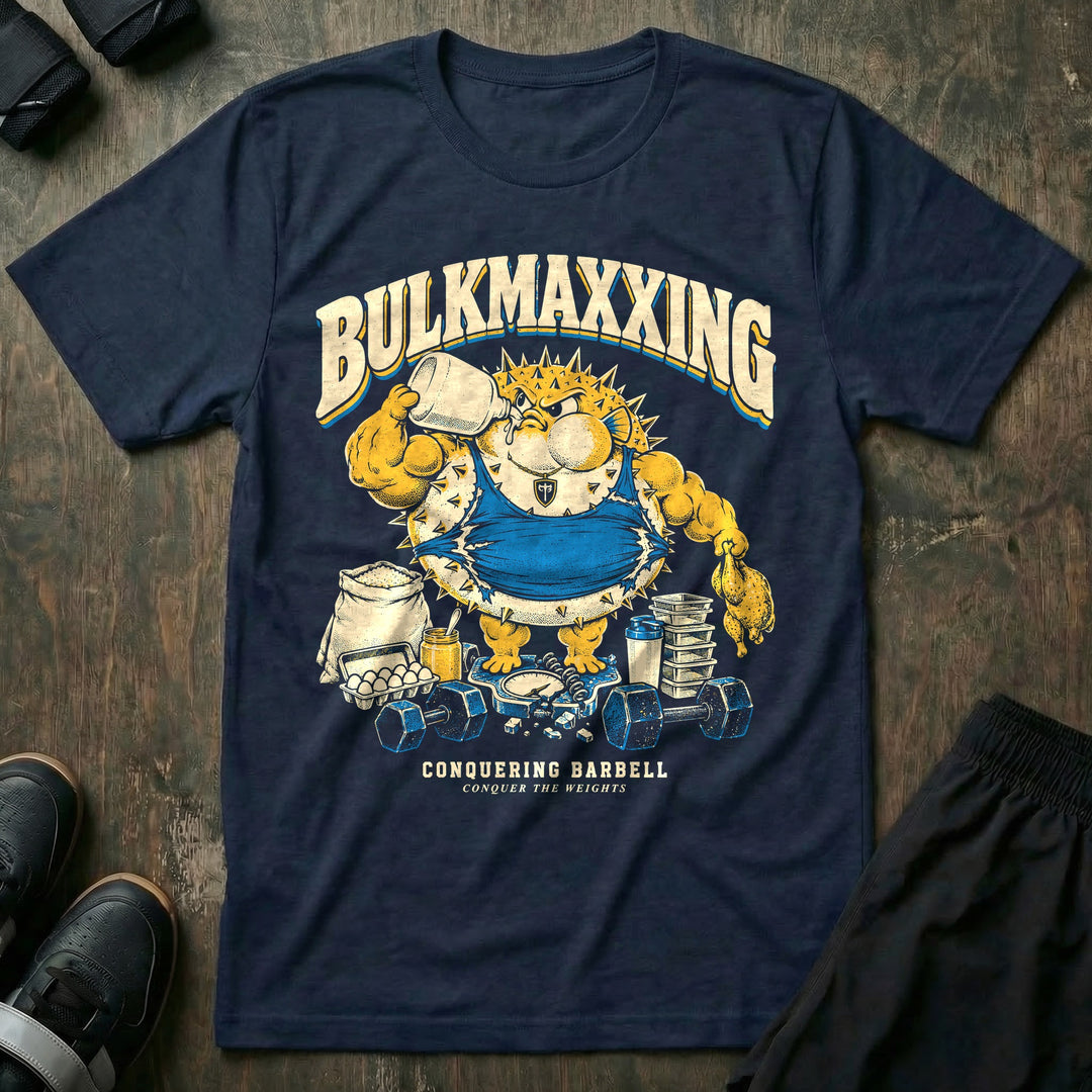 Bulkmaxxing - Tee front graphic in Navy with a muscular pufferfish chugging a jug on a broken scale - Conquering Barbell