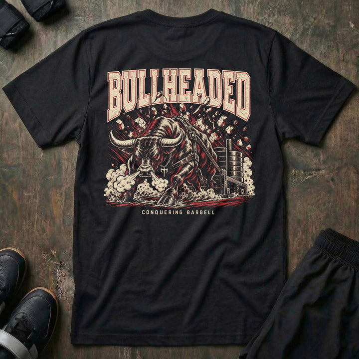 Bullheaded tee in Black: a raging bull breaking through a wall beside a loaded sled