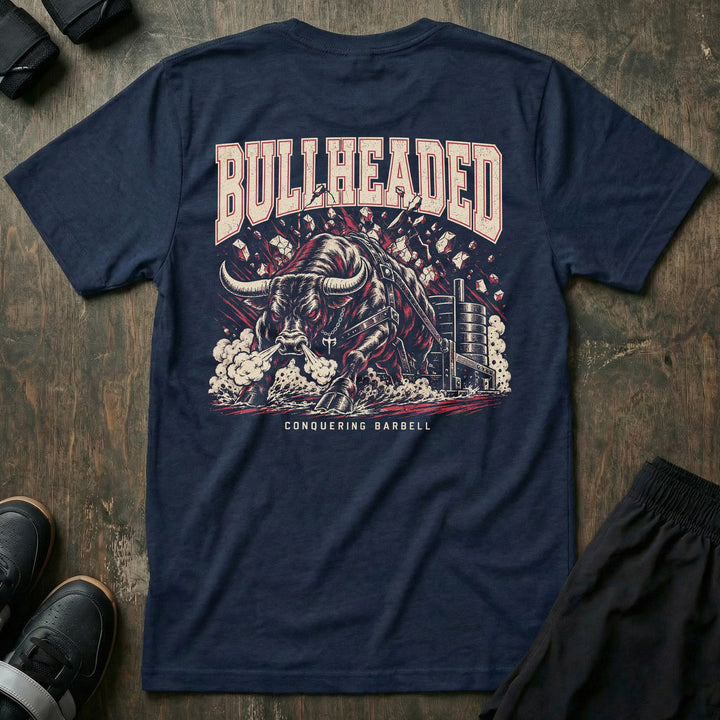 Bullheaded tee in Navy: a raging bull breaking through a wall beside a loaded sled