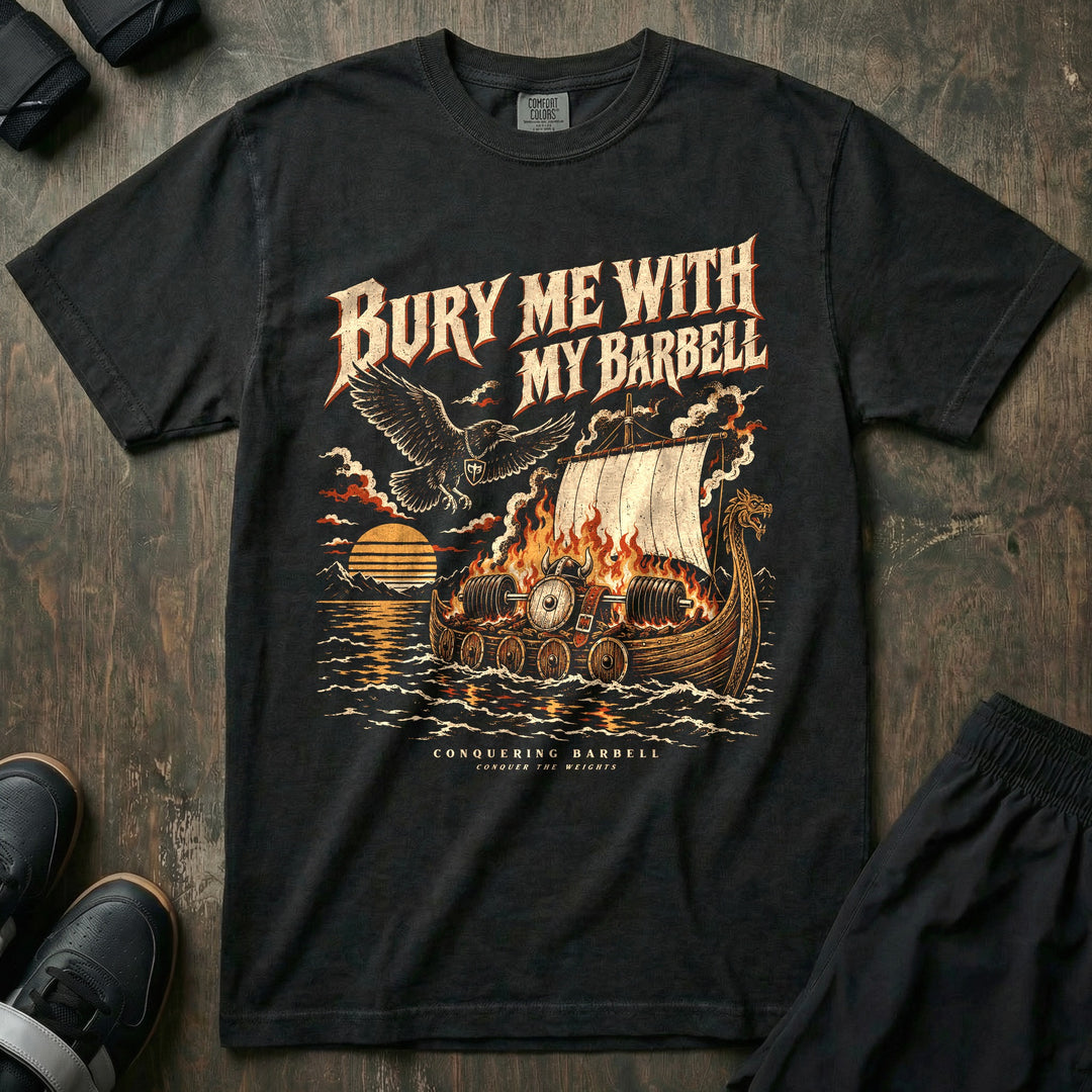 Bury Me With My Barbell - Relaxed Fit Tee front graphic in Black with a burning longship carrying a loaded barbell out to sea at sunset - Conquering Barbell