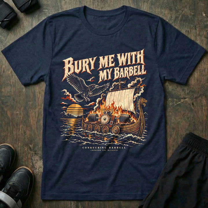 Bury Me With My Barbell - Tee front graphic in Navy with a burning longship carrying a loaded barbell out to sea at sunset - Conquering Barbell