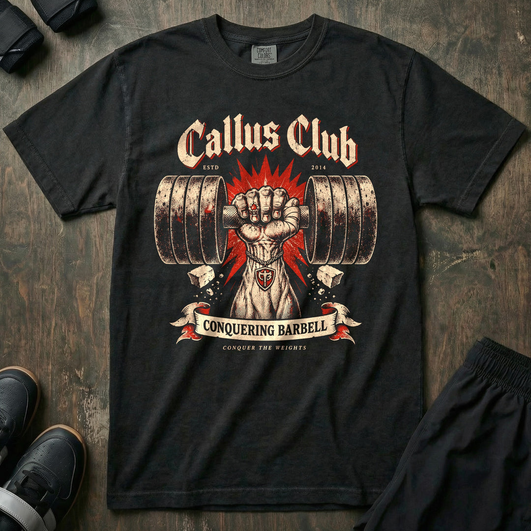 Callus Club - Relaxed Fit Tee front graphic in Black with a taped fist gripping a loaded barbell in a red starburst - Conquering Barbell