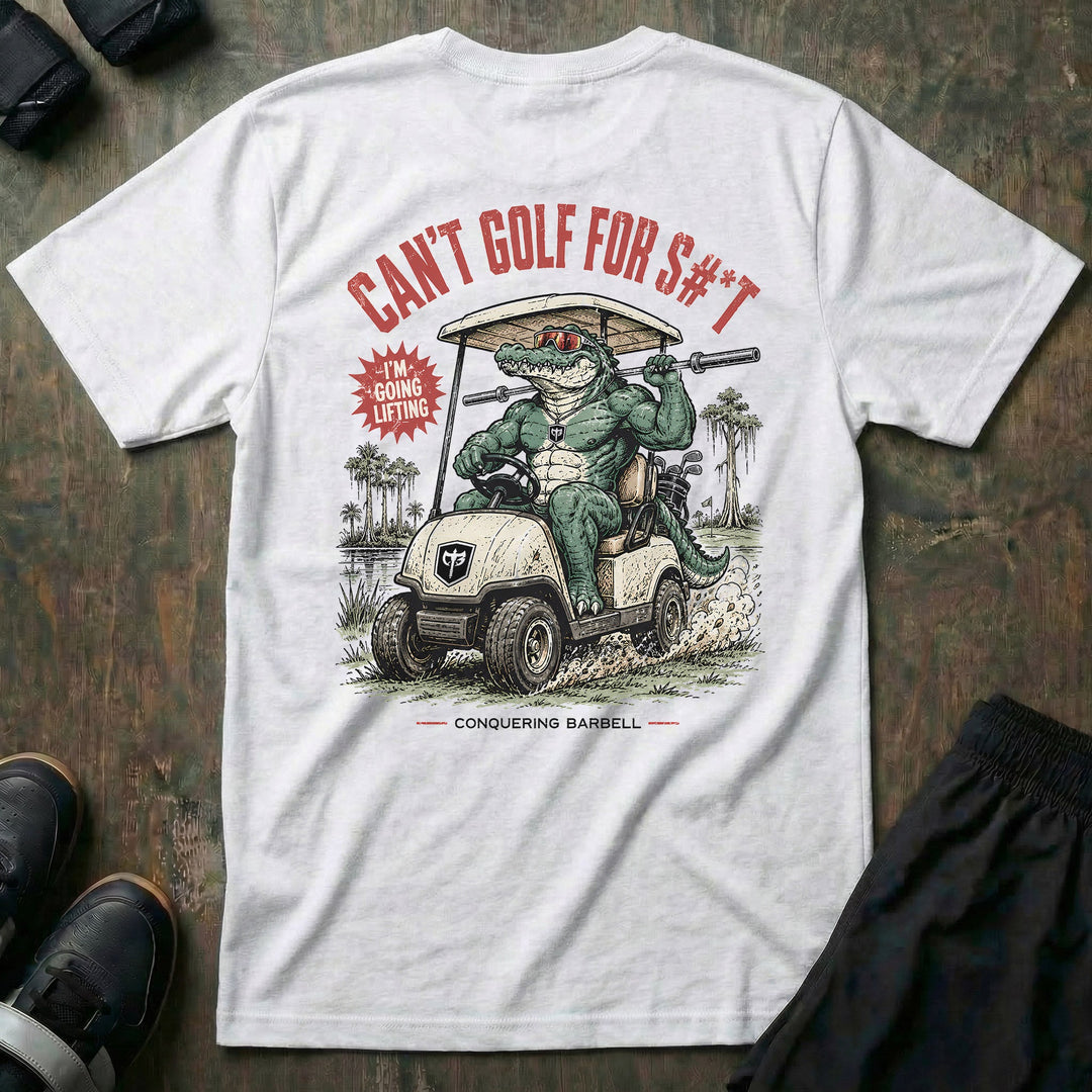 Can't Golf for S#*t tee in White: a jacked gator in sunglasses tearing through the fairway in a CB-branded golf cart