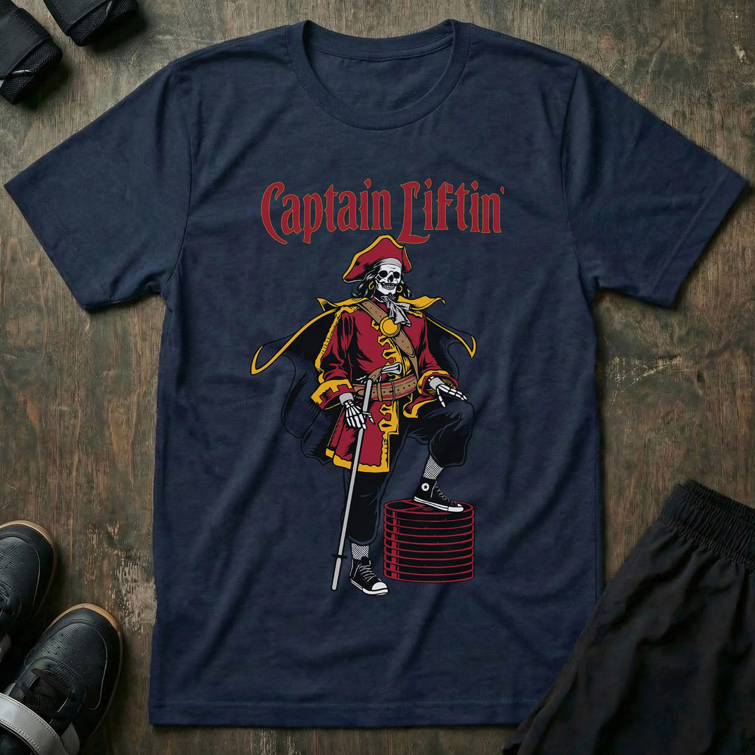Captain Liftin' tee in Navy: a swashbuckling skeleton captain in a red coat with one boot propped on a stack of weight plates