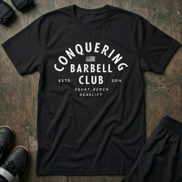 CB LIfting Club tee in Black: CONQUERING arched over an American flag