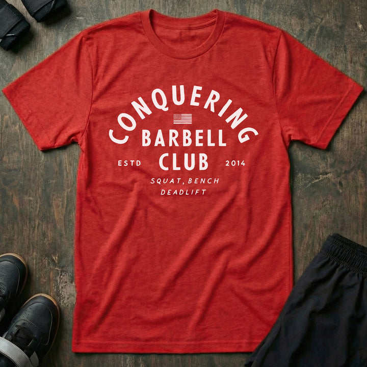 CB LIfting Club tee in Red: CONQUERING arched over an American flag