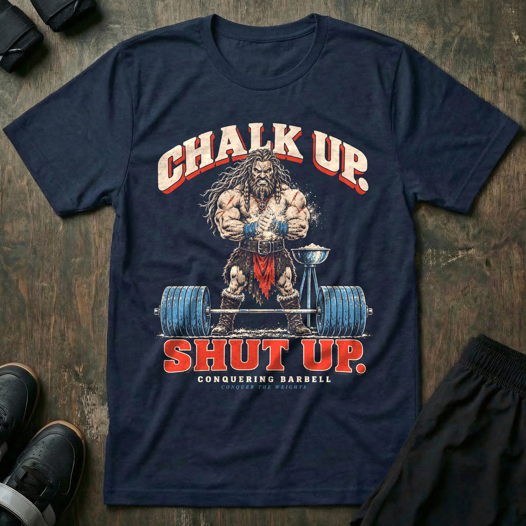 Chalk Up Shut Up - Tee front graphic in Navy with a barbarian clapping chalk over a loaded barbell - Conquering Barbell