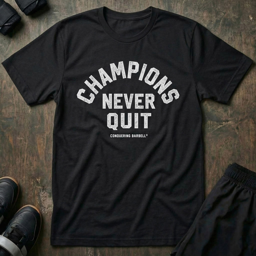 Champions Never Quit tee in Black: CHAMPIONS arched over NEVER QUIT in distressed varsity lettering