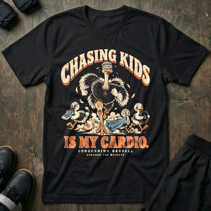 Chasing Kids Is My Cardio - Tee front graphic in Black with an ostrich dad in a headband running after three chicks carrying a sneaker, a towel and a weight plate - Conquering Barbell