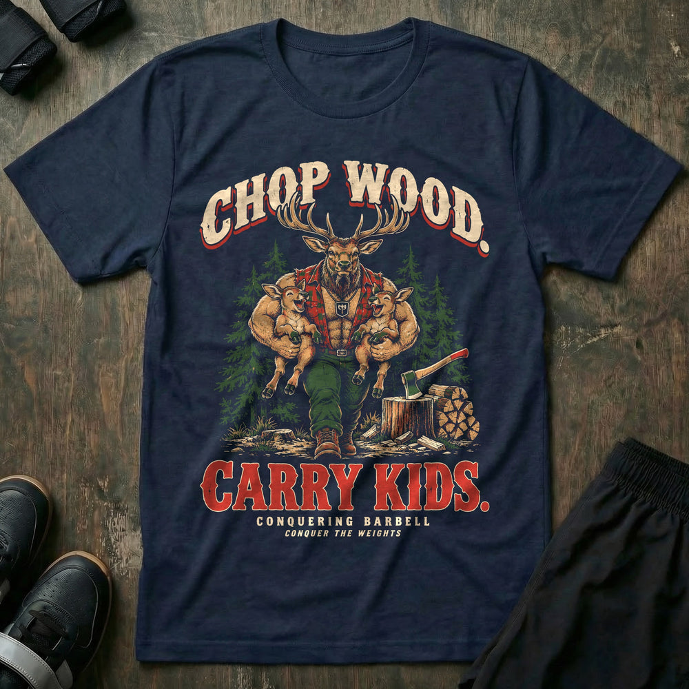 Chop Wood. Carry Kids - Tee front graphic in Navy with a bull elk dad in a red flannel shirt carrying two laughing calves under his arms beside an axe in a stump and stacked firewood - Conquering Barbell