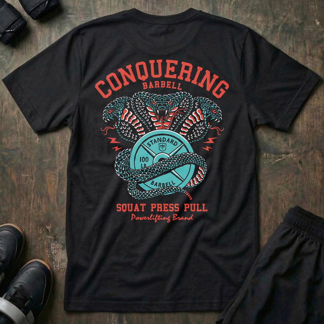 Cobras Squat Press Pull® tee in Black: twin teal cobras rearing over a barbell plate emblem