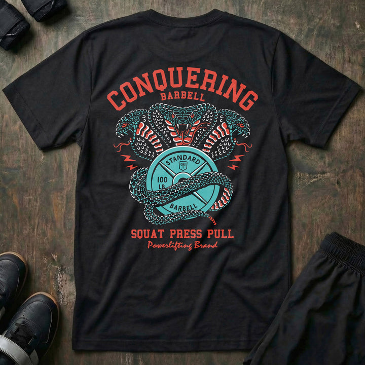Cobras Squat Press Pull® tee in Black: twin teal cobras rearing over a barbell plate emblem