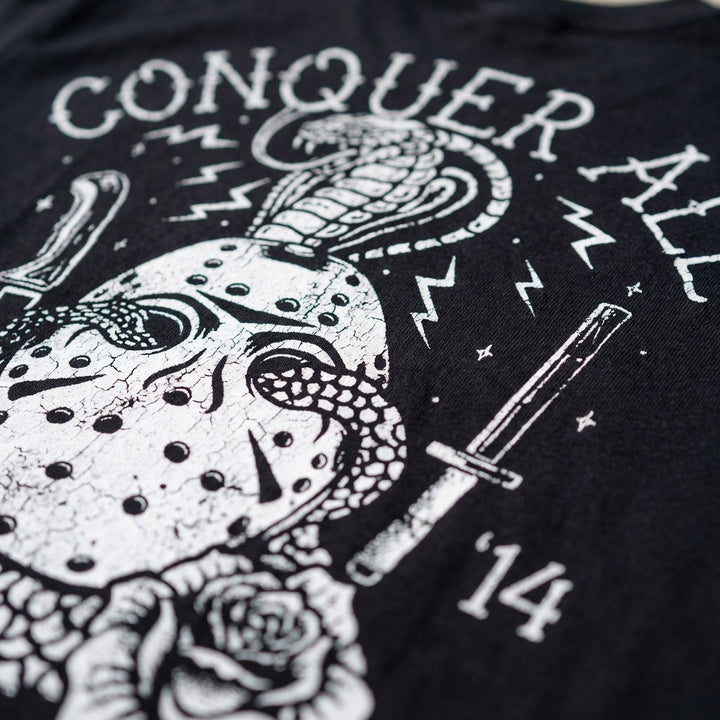 Conquer All Mask tee in Black: a distressed hockey mask wrapped in a coiling cobra