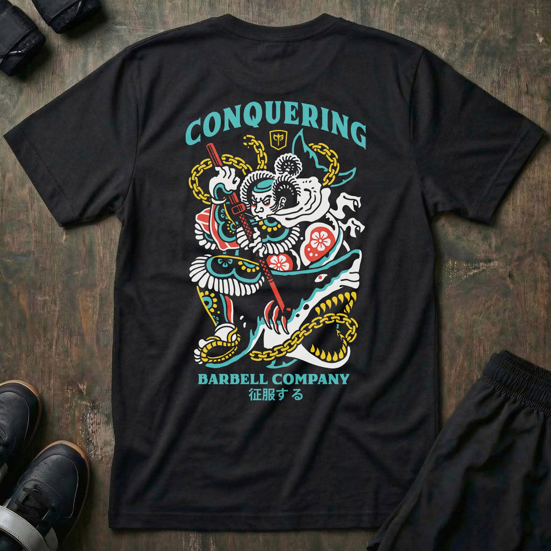 Conquer Bushido tee in Black: a tattoo-style samurai slaying a monstrous shark with chains and a katana in teal