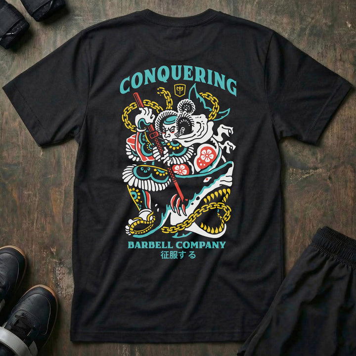 Conquer Bushido tee in Black: a tattoo-style samurai slaying a monstrous shark with chains and a katana in teal