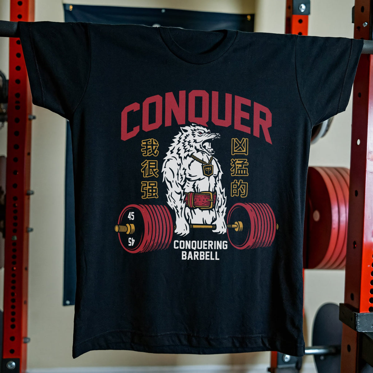 Conquer Deadlifting Wolf V2 tee in Black: a fierce white wolf pulling a heavy red barbell