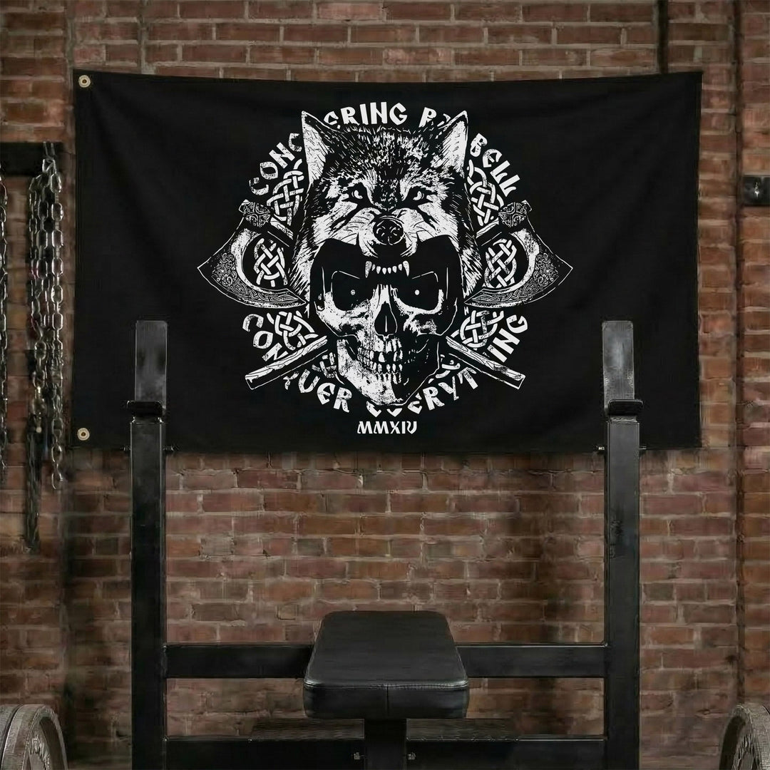 Conquer Everything Flag - Polyester Flag, horizontal black gym flag with skull in a wolf pelt over crossed battle axes - Conquering Barbell