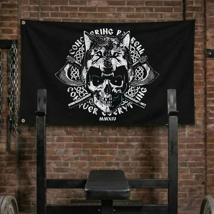 Conquer Everything Flag - Polyester Flag, horizontal black gym flag with skull in a wolf pelt over crossed battle axes - Conquering Barbell