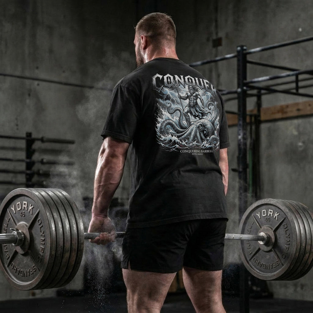 Conquer God of the Seas relaxed fit tee in Black: Poseidon riding a massive kraken rising from the ocean depths