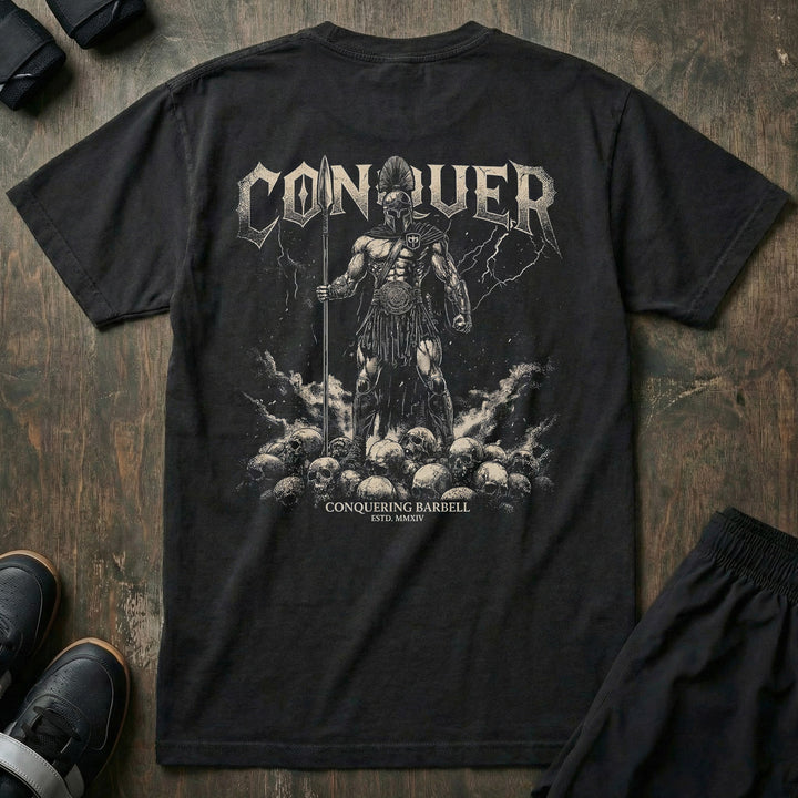 Conquer Ares relaxed fit tee in Black: a Spartan warrior standing atop a mountain of skulls