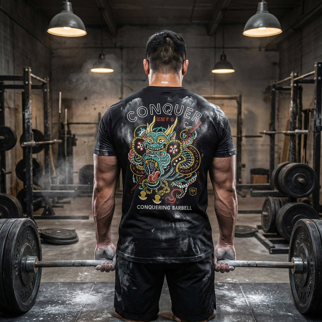 Conquer Gorilla tee in Black: an ornate tattoo-style gorilla wrapped in clouds and dragon scales in teal