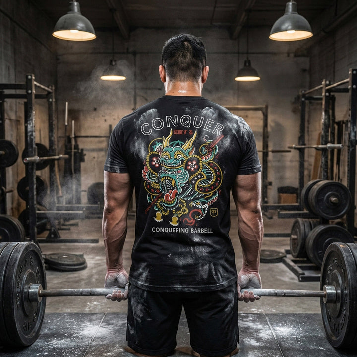 Conquer Gorilla tee in Black: an ornate tattoo-style gorilla wrapped in clouds and dragon scales in teal