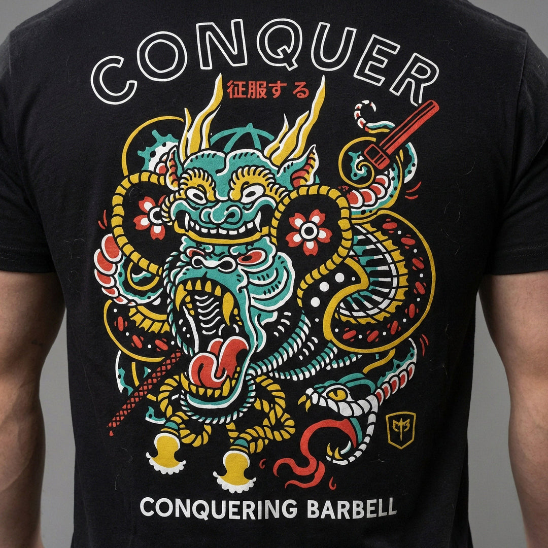 Conquer Gorilla tee in Black: an ornate tattoo-style gorilla wrapped in clouds and dragon scales in teal